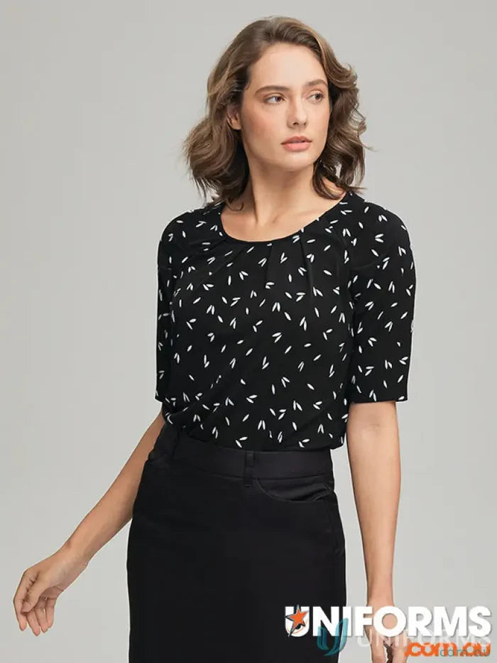 Woman wearing Petal Print Knit blouse with city collection petal skirt in recycled polyester