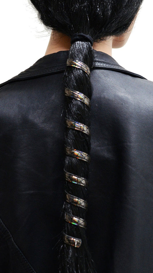 12 inch holographic black anodized aluminum ponytail wrap, spiral design, front view on white background