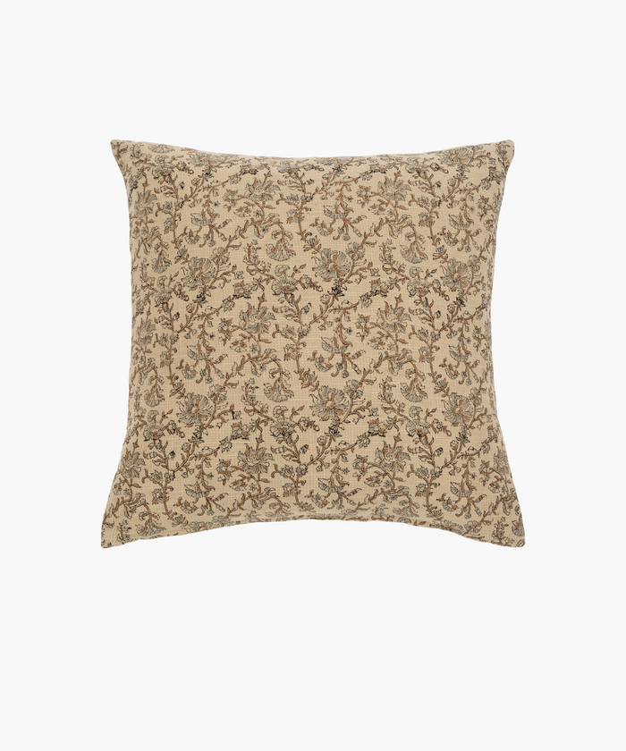 A square beige pillow features an intricate floral pattern in shades of brown and gray, conveying an elegant and vintage aesthetic. | Wildwood Home Co.