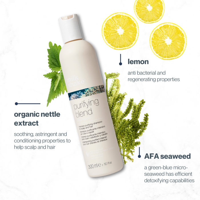 milk_shake shampoo bottle with lemon slices, nettle leaves, and seaweed on a white background