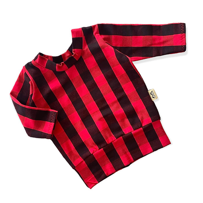 Handmade red buffalo plaid pullover for kids, featuring long sleeves and soft, cozy fabric perfect for winter.