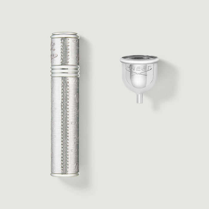 Silver 10ml Refillable Travel Perfume Atomizer with Engraved Creed Crest & Filling Funnel - Flat Lay | Creed Boutique
