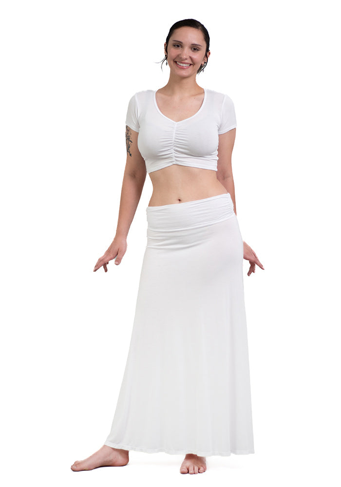 Woman wearing a white rayon/spandex crop-top with short sleeves and front shirring on a white background.