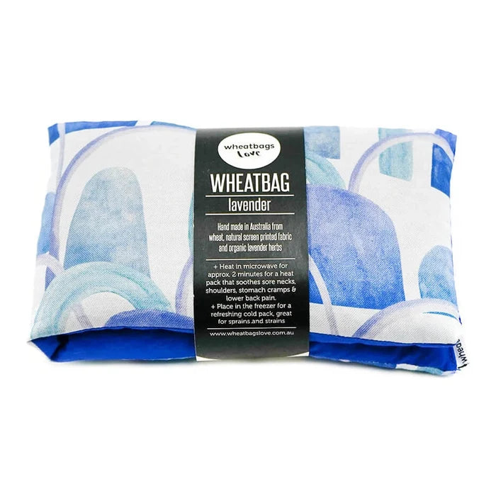 Lavender wheatbag with paper label wrapped around the middle. Hand made in Aus from wheat, natural screen printed fabric & organic lavender.