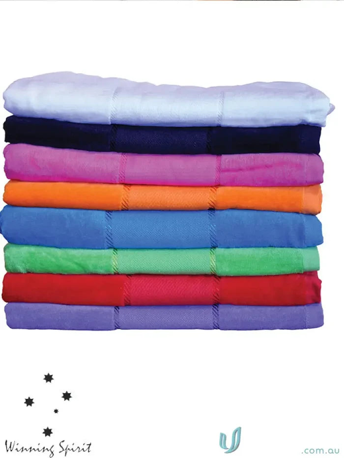 Colorful stack of terry velour beach blankets, perfect velour beach towel for summer