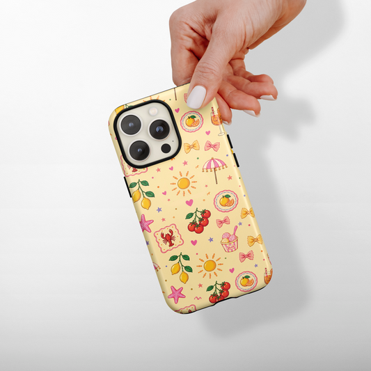 Phone case with colorful pattern held by a hand on a light gray background