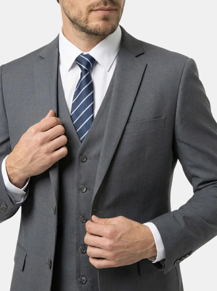 LondonLaneStore Troy men's three-piece suit showing tailored fit, classic style with jacket, vest, and trousers in a formal setting.