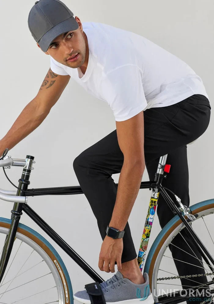 Man on bicycle wearing Venture Pant from Biz Collection Men’s collections venture lineup