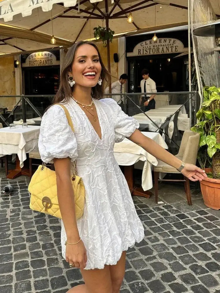 Women's airy fabric summer dress by LondonLaneStore, elegant white dress with embroidered ruffles and a flowing, lightweight design.