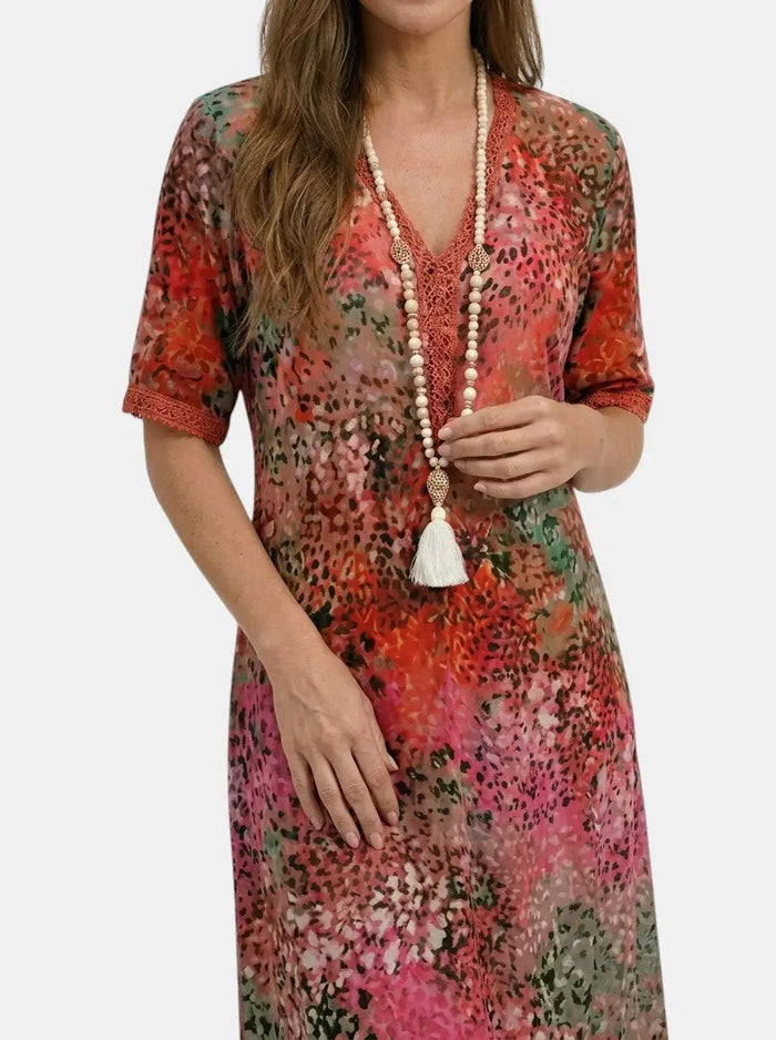 Women's printed V-neck midi dress by LondonLaneStore with relaxed fit and short sleeves, featuring a vibrant all-over floral pattern.