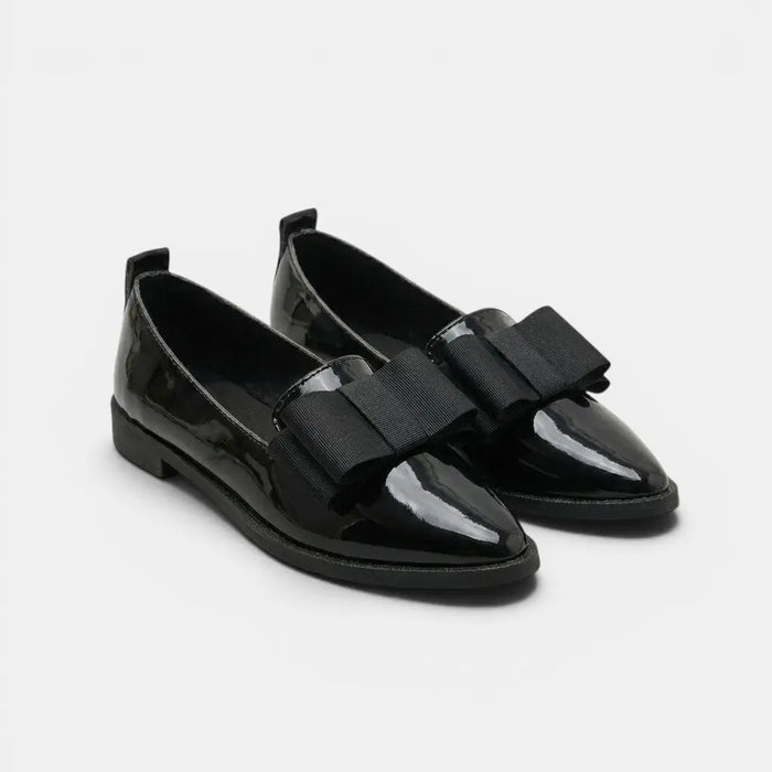 Black patent leather women's loafers with pointed toe and slip-on design, featuring elegant and polished style.