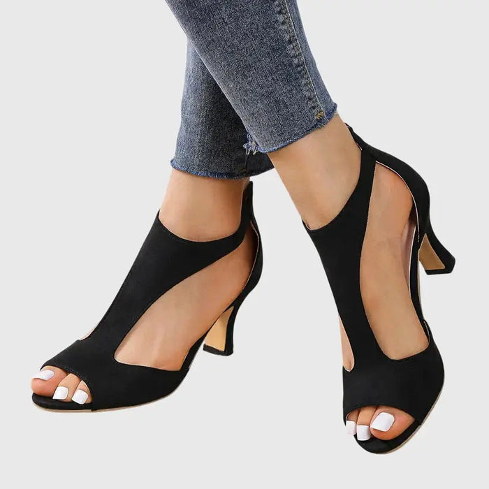 Women’s breathable black orthopedic heels with elegant design and supportive comfort, ideal for stylish, supportive footwear.