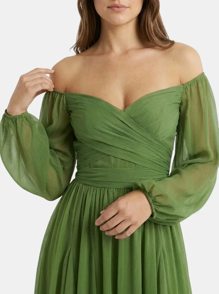 Women's breathable fabric mini dress featuring an elegant wrap design and pleated skirt, perfect for summer wear.