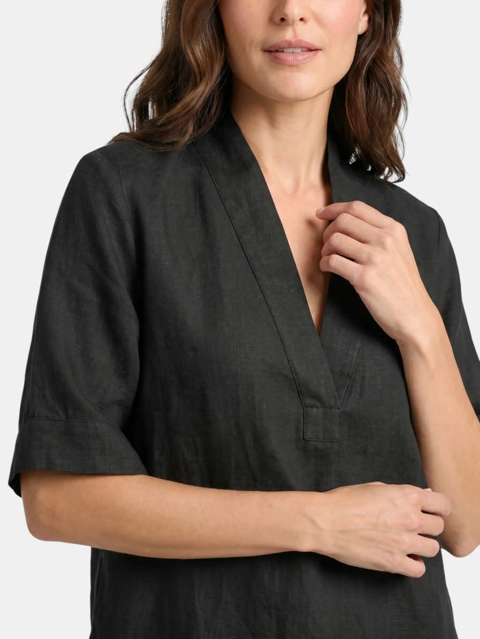 Women's breathable linen co-ord set featuring a relaxed V-neck top and wide-leg trousers, perfect for casual summer wear.