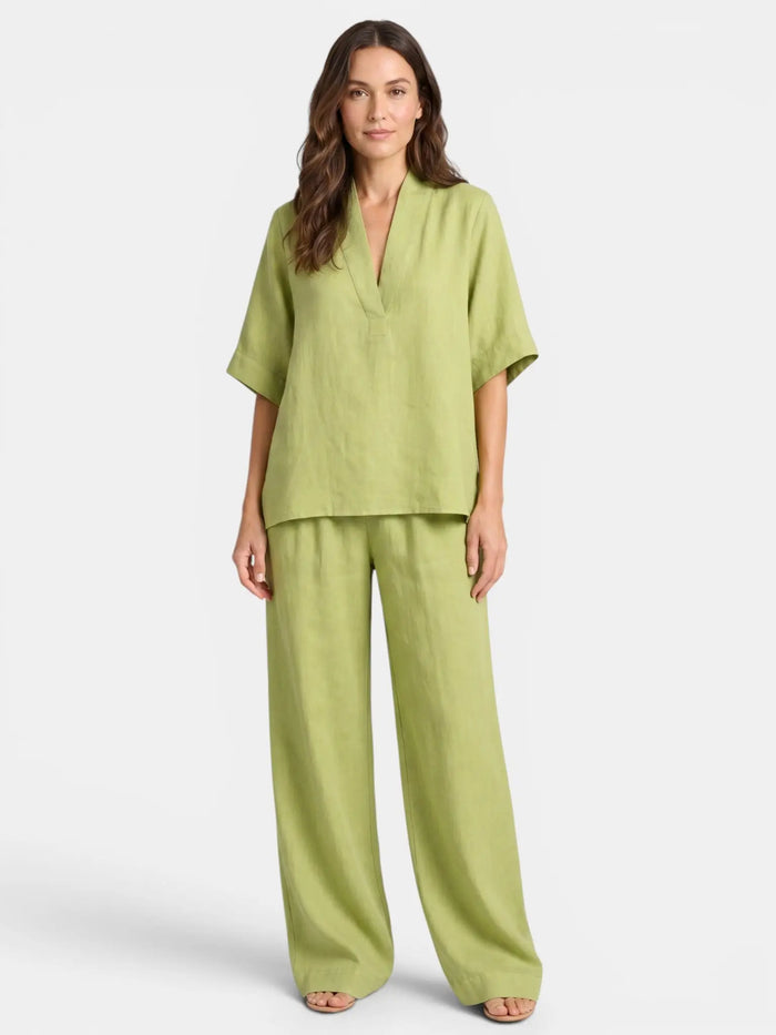 Women's breathable linen co-ord set with relaxed V-neck top and wide-leg trousers, stylish and comfortable for everyday wear.
