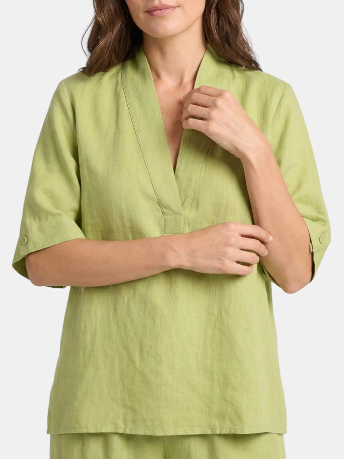 Women's breathable linen co-ord set featuring a relaxed V-neck top and wide-leg trousers, perfect for casual and summer wear.