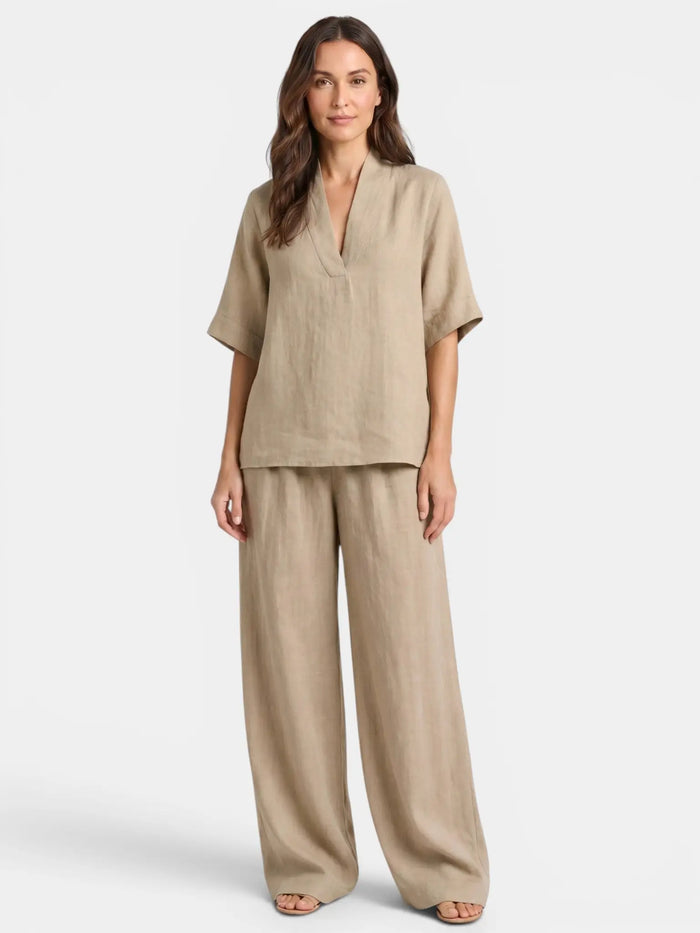 Women's breathable linen co-ord set featuring a relaxed V-neck top and wide-leg trousers, perfect for casual summer wear.