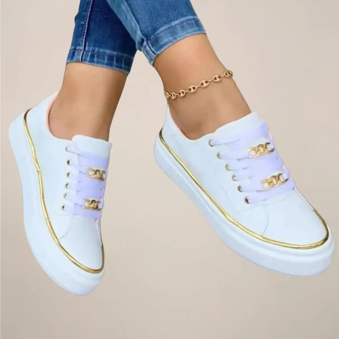 Women’s casual fabric sneakers by LondonLaneStore featuring white low-top trainers with gold accents and stylish design.