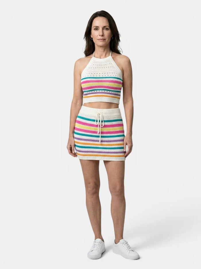 Women's colorful crochet knit two-piece set with playful halter crop top and fitted mini skirt, vibrant and stylish for casual wear.