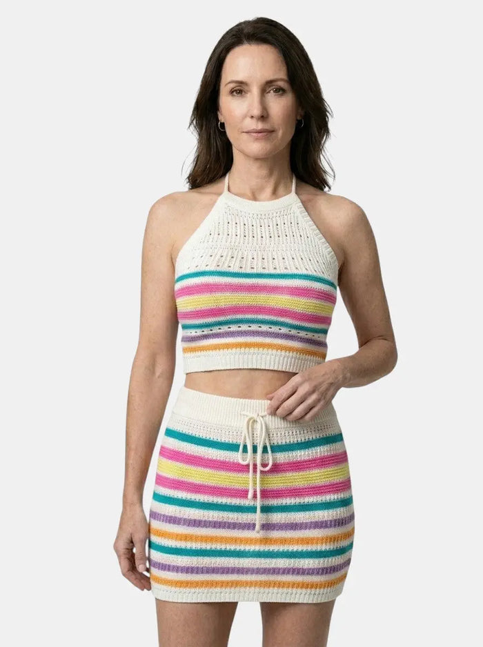Women's colorful crochet knit two-piece set featuring a playful halter crop top and fitted mini skirt, perfect for casual wear.