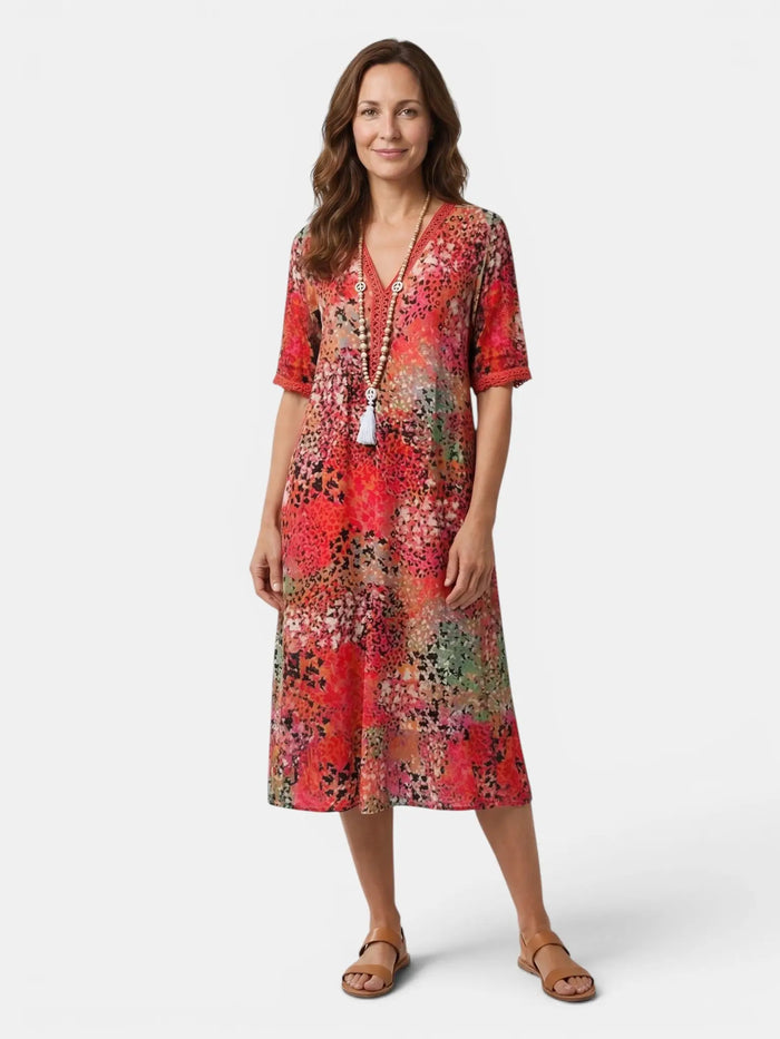 Women's colorful printed midi dress by LondonLaneStore, relaxed fit summer dress ideal for casual wear, with vibrant floral patterns.