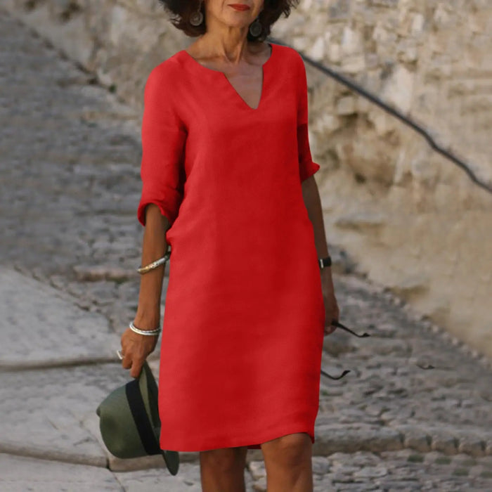 Women’s comfortable V-neck midi dress with 3/4 sleeves, casual elegant style by LondonLaneStore, shown in a natural pose.