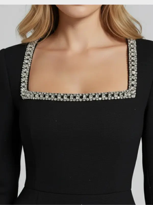 Women's black cotton bodycon mini dress with elegant square neckline and long sleeves, stylish and figure-hugging.