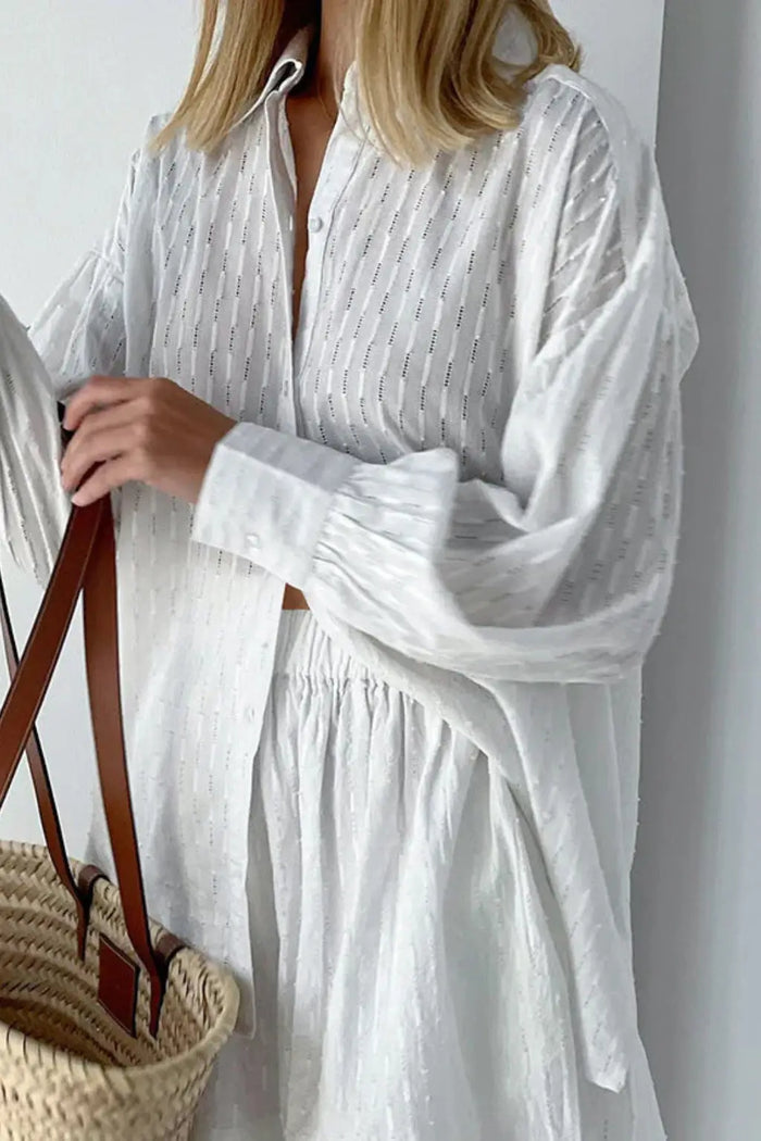 Women’s cotton broderie summer two-piece suit with relaxed oversized shirt and matching shorts, stylish and breathable for warm weather.