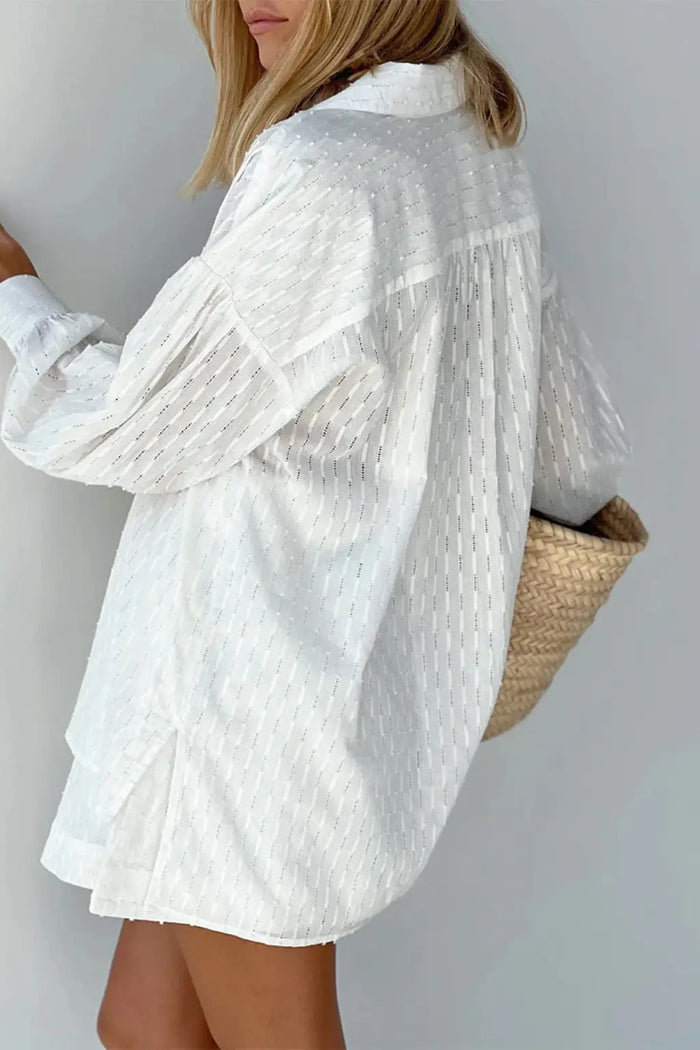 Women’s cotton broderie summer two-piece suit featuring a relaxed oversized shirt and matching shorts, ideal for warm weather.