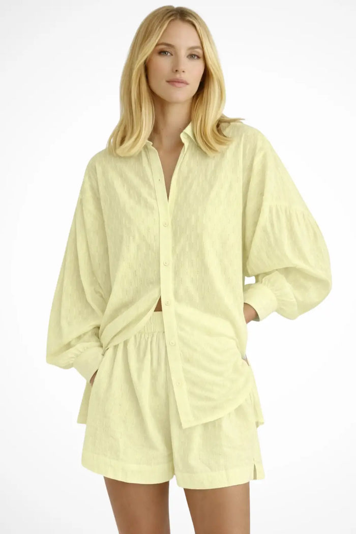Women’s cotton broderie summer two-piece suit with a relaxed oversized shirt and matching shorts, perfect for warm weather.