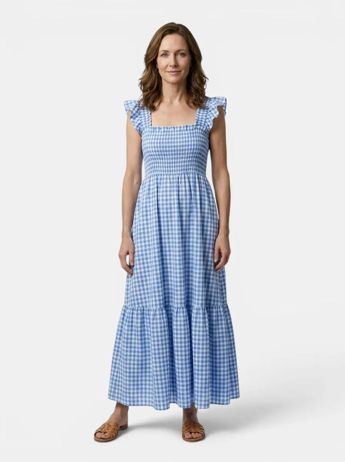 Women's cotton gingham maxi dress with flowing silhouette, perfect for summer, in a classic gingham pattern.