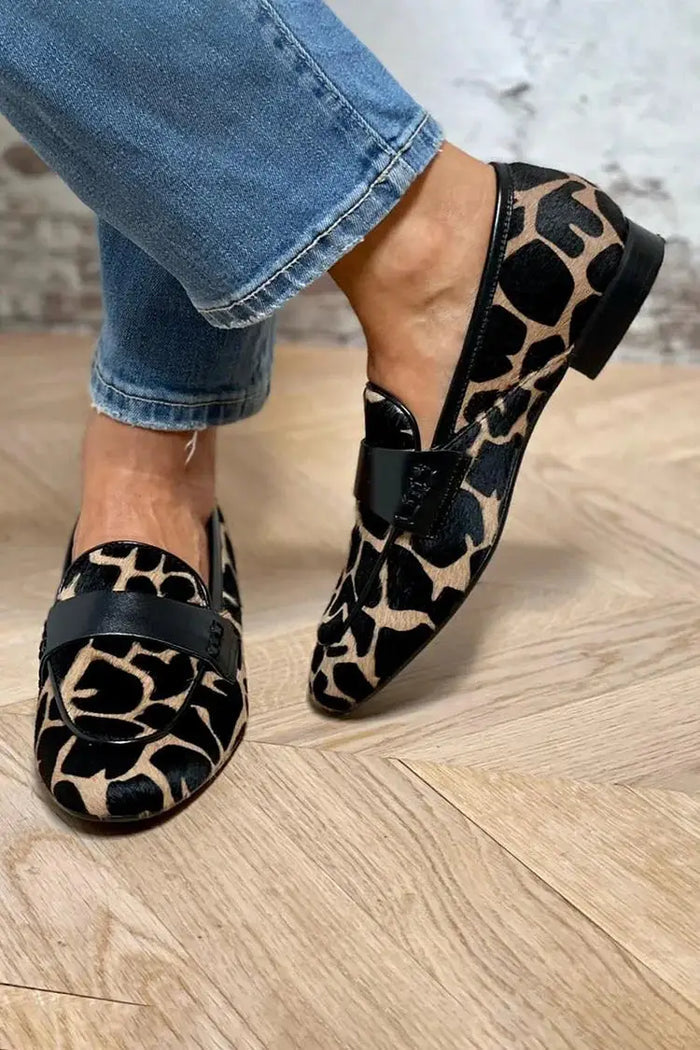 Women’s cow print loafers by LondonLaneStore, cozy slip-on shoes with a stylish cow pattern, ideal for comfortable everyday wear.