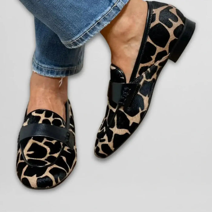 Women's cow print loafers by LondonLaneStore, cozy slip-on shoes with comfortable everyday wear and stylish design.