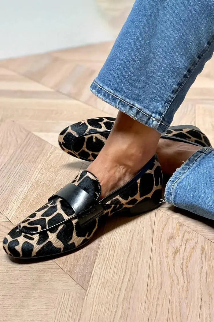 Women's cow print loafers by LondonLaneStore, cozy slip-on shoes with a stylish cow pattern, perfect for comfortable everyday wear.
