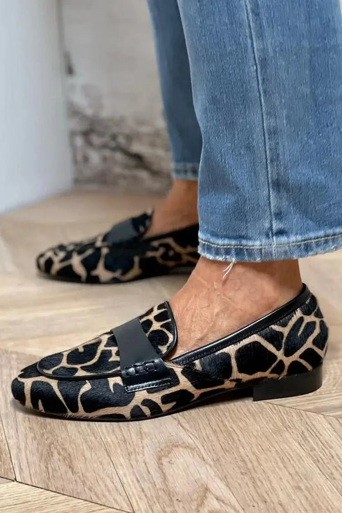 Women's cow print loafers from LondonLaneStore featuring slip-on style, cozy chic design, and comfortable everyday footwear.