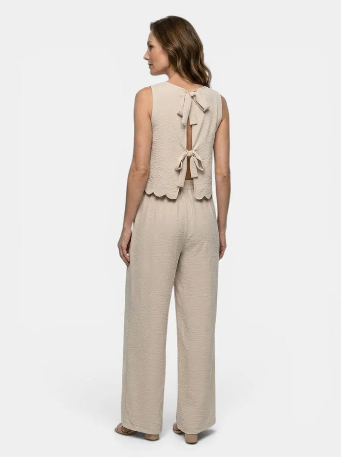 Women's crinkle fabric co-ord set with relaxed sleeveless top and wide-leg trousers, stylish and comfortable casual outfit.