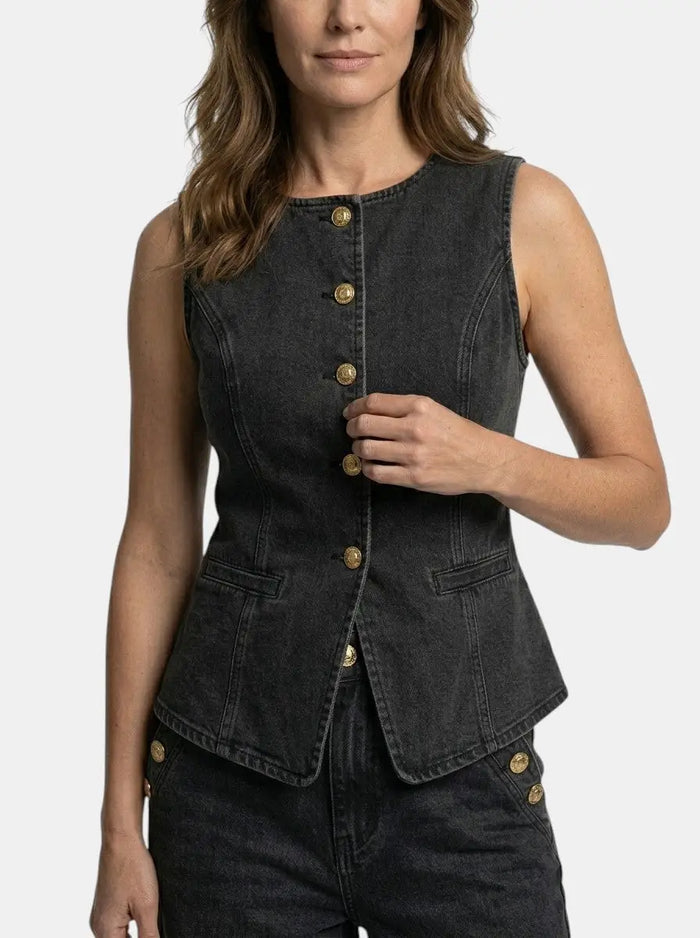 Women's denim co-ord set featuring a tailored waistcoat and wide-leg trousers, stylish and casual denim outfit.
