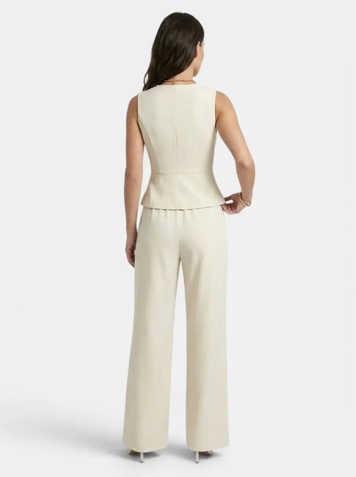 Elegant cream women's wide-leg trouser suit with tailored V-neck waistcoat, perfect for special occasions.