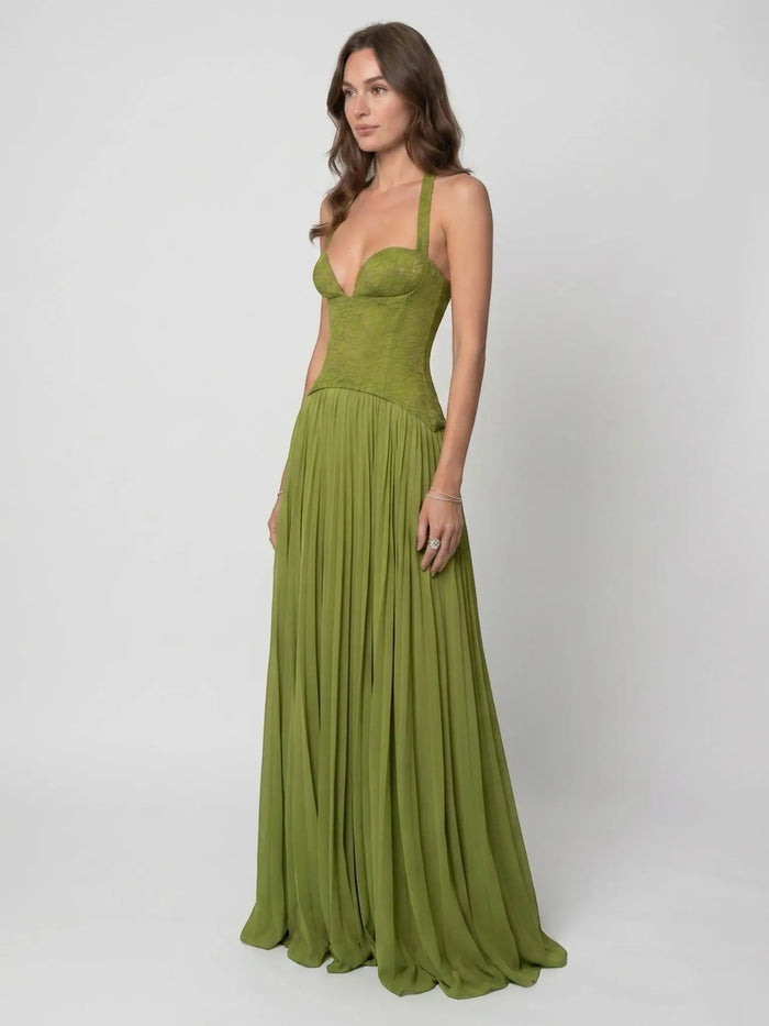 Women's elegant draped pleated maxi dress with structured corset style, featuring flowing fabric and sophisticated evening gown design.