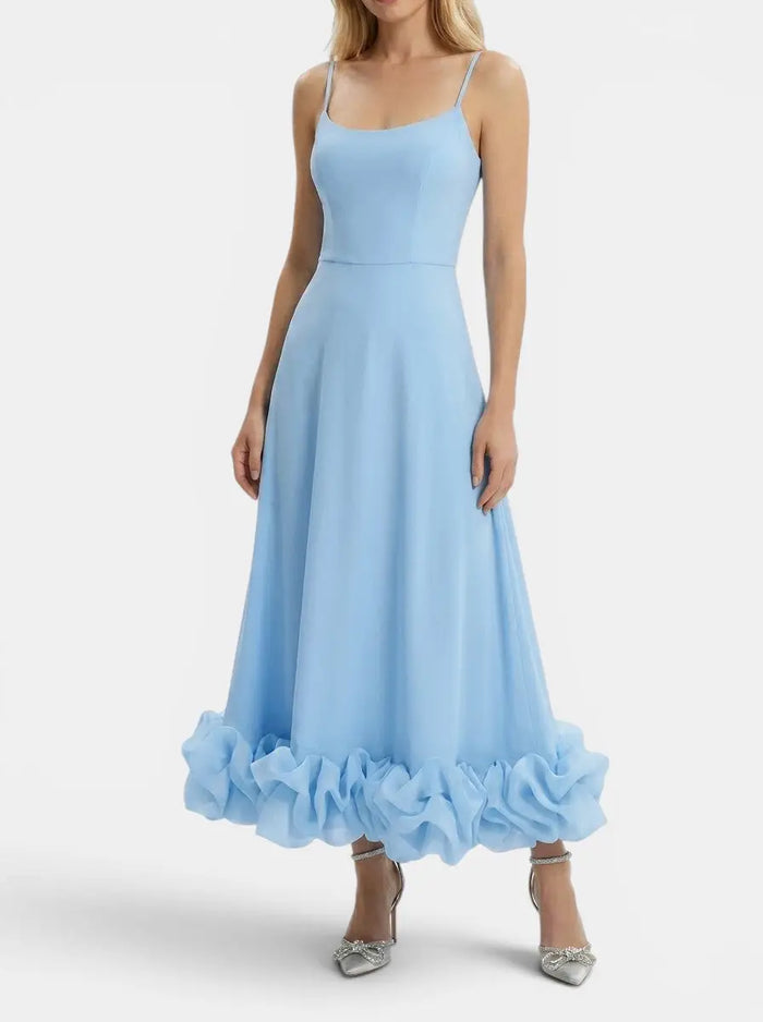 Elegant women's midi evening dress with ruffle details, made from stylish fabric, perfect for formal occasions.