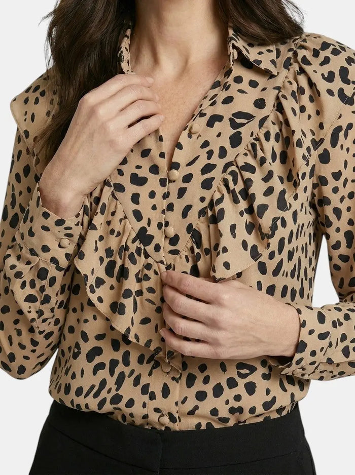 Women's leopard print long sleeve blouse from LondonLaneStore, stylish all-season top with elegant animal print design.