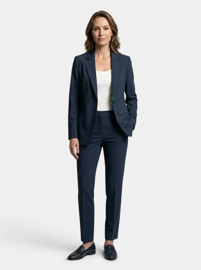 Elegant navy blue women's suit featuring a tailored blazer and straight-leg trousers, perfect for professional or formal wear.