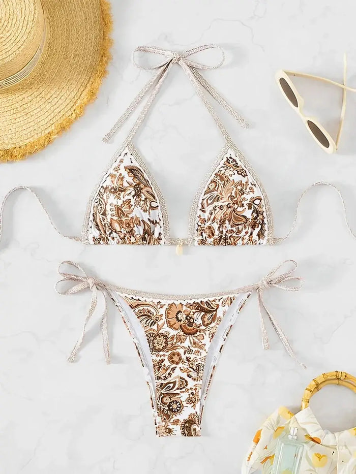 Women wearing an elegant paisley print bikini set by LondonLaneStore, featuring adjustable straps and a stylish summer swimwear look.