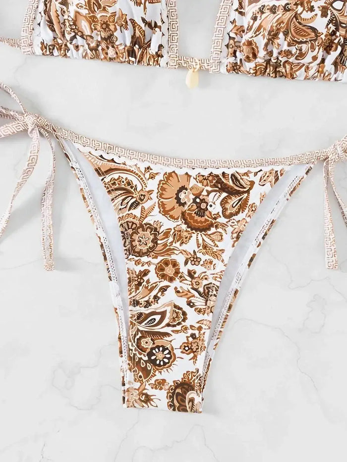 Women wearing an elegant paisley print bikini set by LondonLaneStore, featuring adjustable straps and comfortable swimwear for summer.