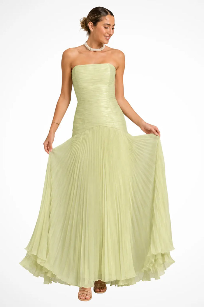 Women's elegant strapless pleated maxi dress with drop waist, featuring flowing fabric and sophisticated style by LondonLaneStore.