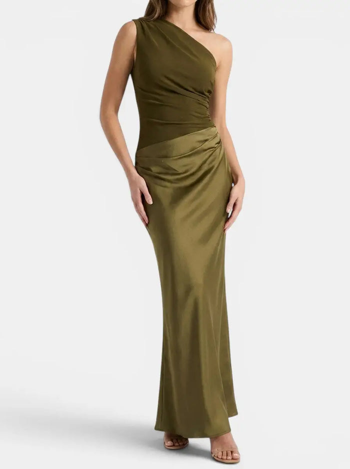 Elegant women's pleated maxi dress with a stylish one-shoulder design, featuring flowing fabric and a formal gown silhouette.