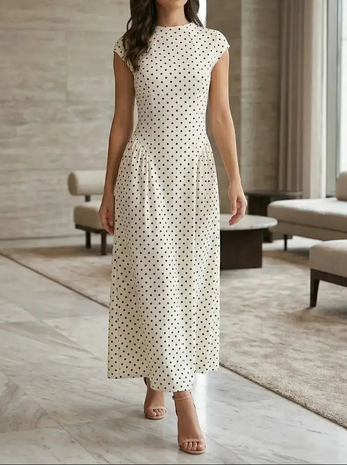 Women's elegant polka dot maxi dress with cap sleeves and A-line silhouette, perfect for summer occasions.