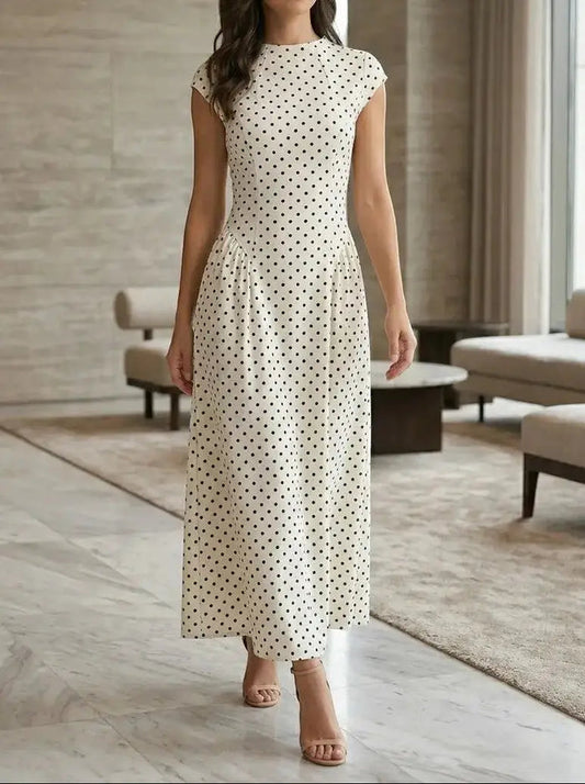 Women's elegant polka dot maxi dress with cap sleeves and A-line silhouette, perfect for summer occasions.