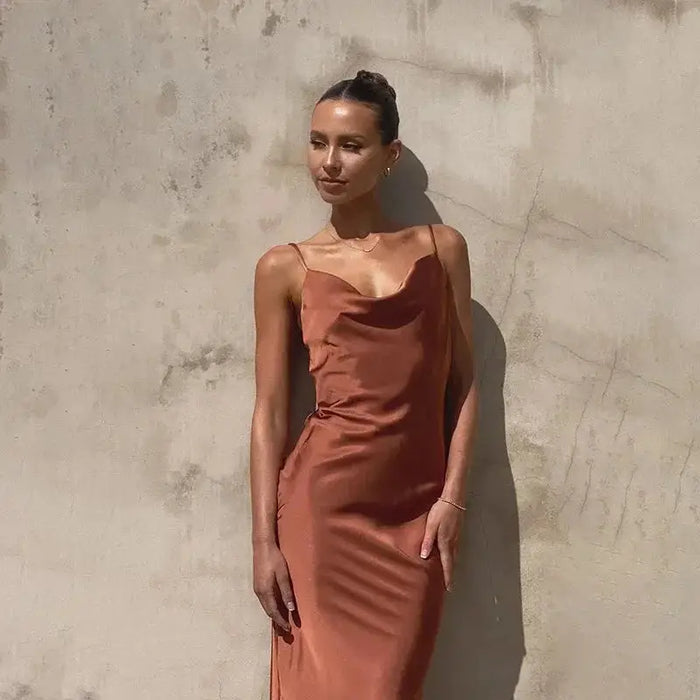 Elegant women's satin maxi dress with sleeveless design and draped cowl neck, perfect for formal occasions.