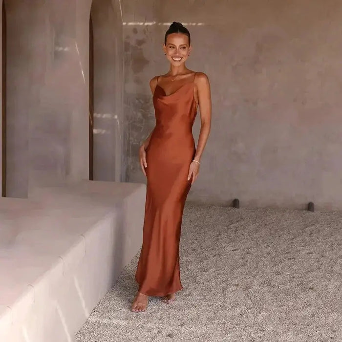 Elegant women's satin maxi dress with sleeveless design and draped cowl neck, perfect for formal occasions.